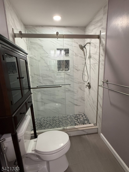 Undisclosed Address Edison, NJ 08820 - Photo 29 of 44 a bathroom with a shower and toilet