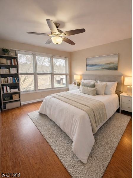 Undisclosed Address Edison, NJ 08820 - Photo 30 of 44 a bedroom with a large bed and a large window