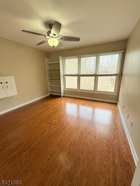 Undisclosed Address Edison, NJ 08820 - Photo 31 of 44 wooden floor in an empty room with a window