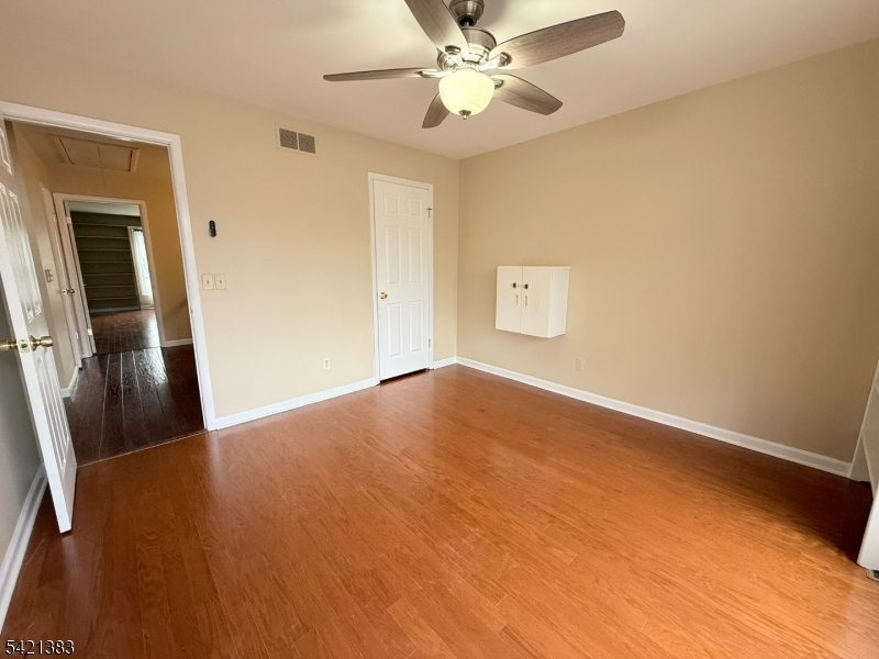 Undisclosed Address Edison, NJ 08820 - Photo 32 of 44 a view of empty room with wooden floor
