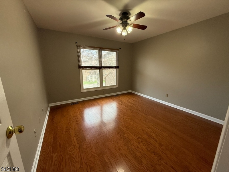 Undisclosed Address Edison, NJ 08820 - Photo 34 of 44 wooden floor in an empty room with a window