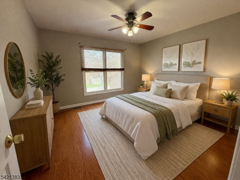 Undisclosed Address Edison, NJ 08820 - Photo 35 of 44 a spacious bedroom with a large bed and a chandelier
