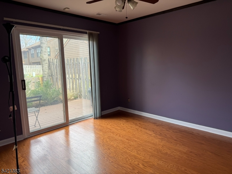 Undisclosed Address Edison, NJ 08820 - Photo 6 of 44 a view of an empty room with wooden floor and a window