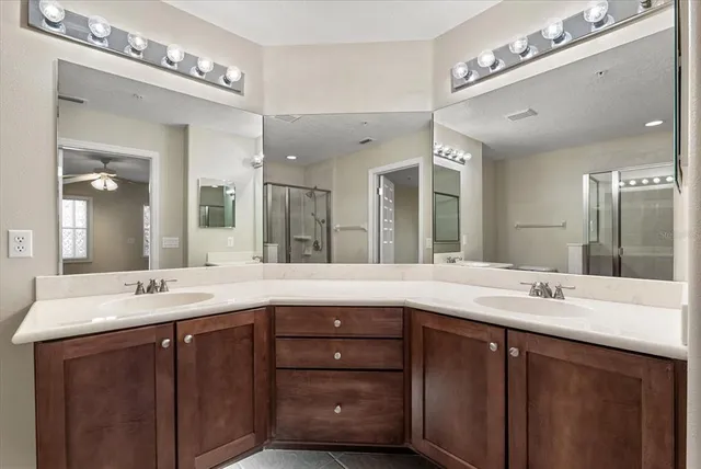 a bathroom with a double vanity sink and a mirror