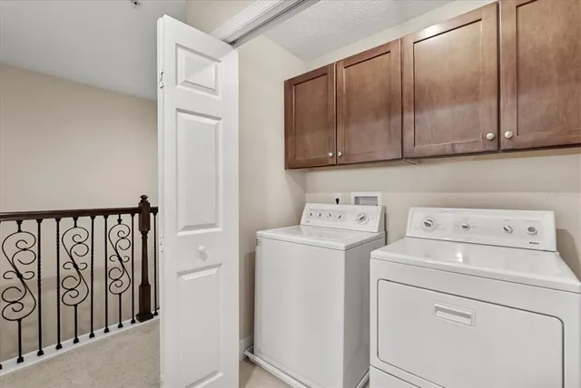 a view of storage and utility room with washer and dryer