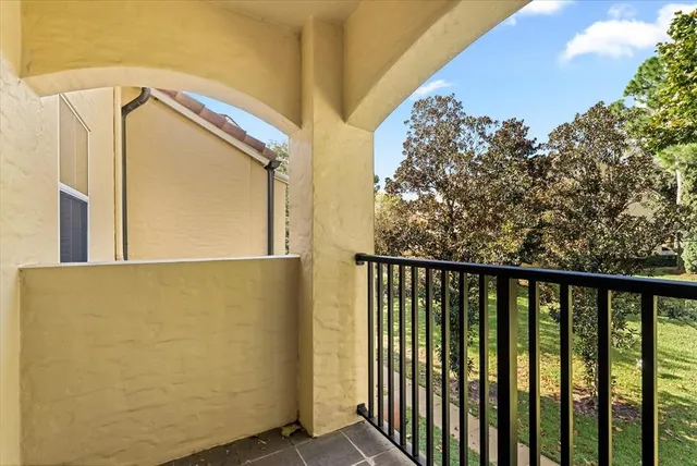 a view of wooden door and glass door