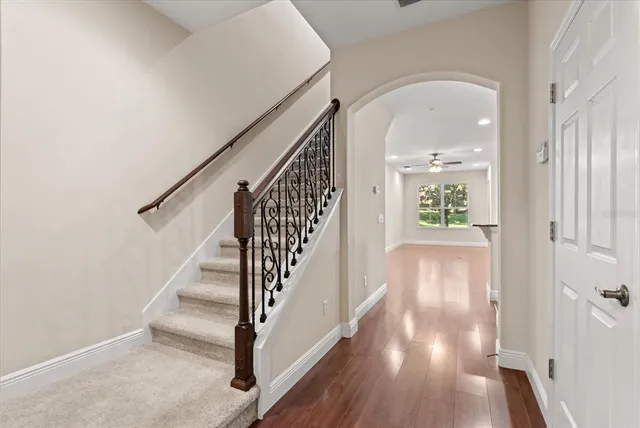 a view of entryway and hall with wooden floor