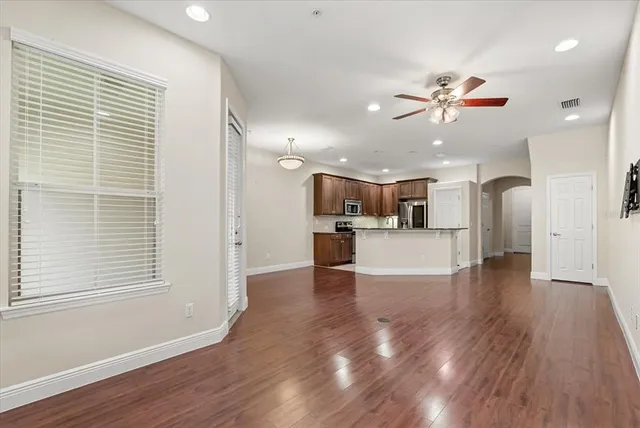 a view of a kitchen with a dishwasher cabinets and wooden floor