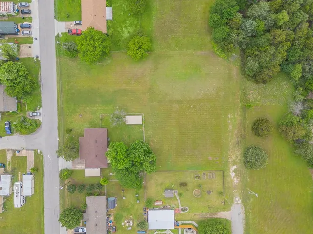 an aerial view of a residential apartment building with swimming pool