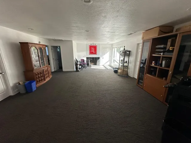 a view of a livingroom with storage & utility room