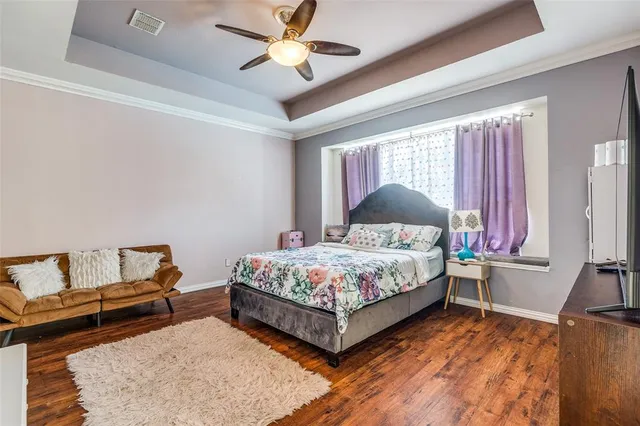 a bathroom with sink a large mirror and a bathtub