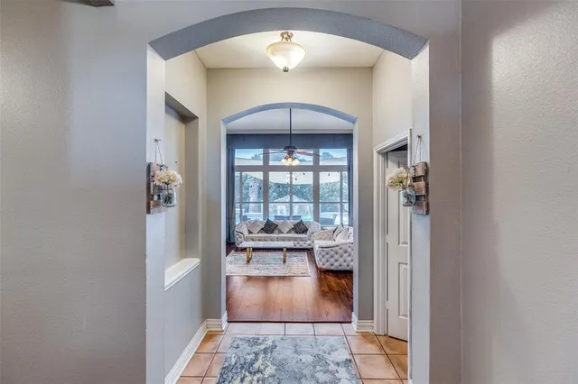 a view of a hallway with a living room