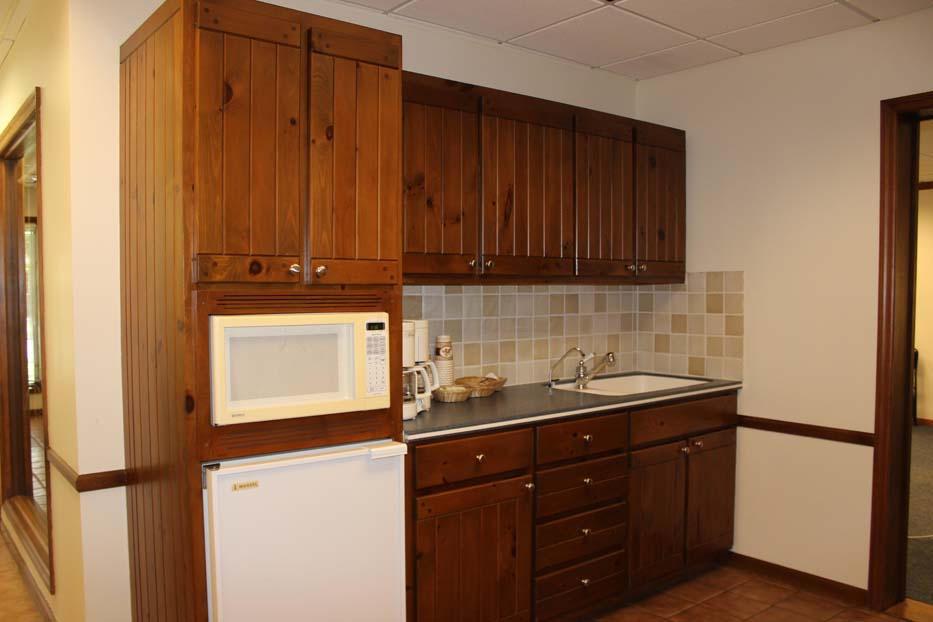 1900 Bethel Road Columbus, OH 43235 - Photo 8 of 24 Ceramic tile flooring. Ivory painted walls. Fluted cabinets. Double bowl sink with instant hot water tap. Ceramic tile backsplash. Corian countertops. Kenmore microwave. Marvel refrigerator. Chair railing.