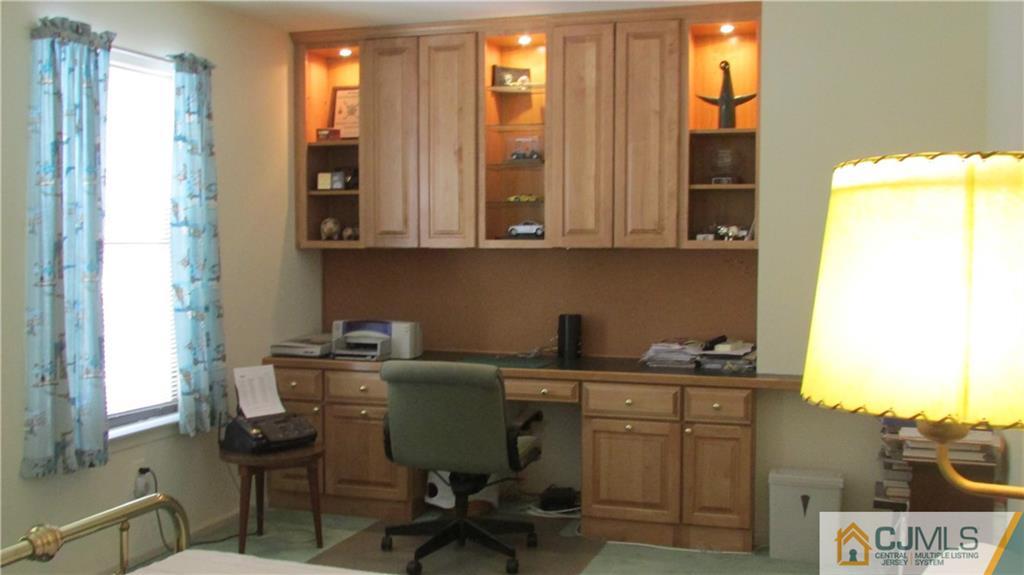 2407 Timber Oaks Road, Unit 2407 Edison, NJ 08820 - Photo 12 of 12 a view of a workspace with furniture and a window