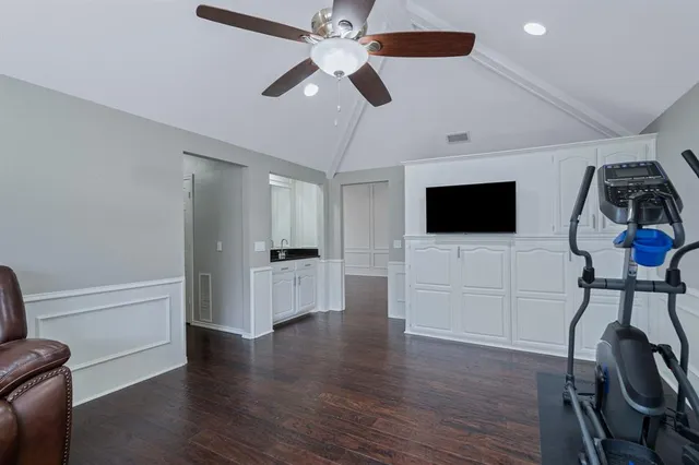 a view of living room with furniture and a flat screen tv