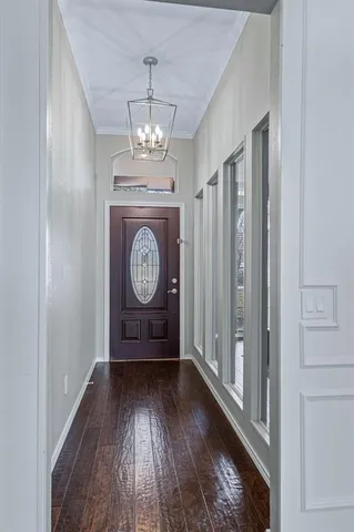 a view of an entryway with wooden floor
