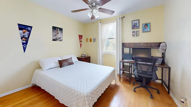 a bedroom with a bed and a table in it