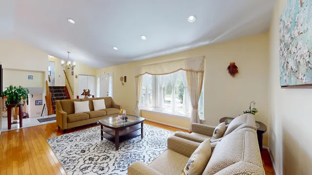 a living room with furniture or couch and a wooden floor