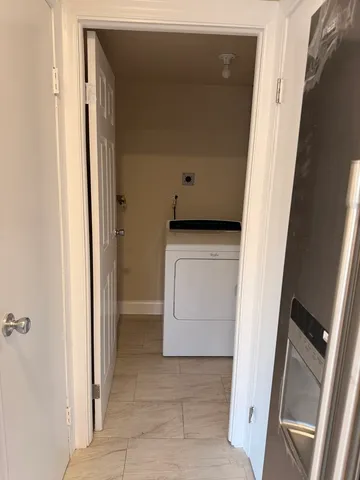 a utility room with washer and dryer