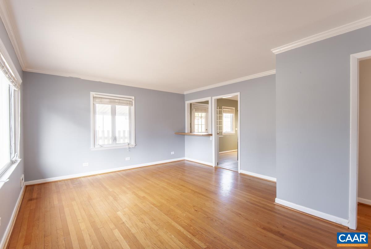 2600 Willard Drive Charlottesville, VA 22903 - Photo 12 of 47 an empty room with wooden floor and windows