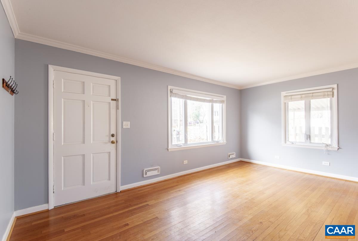 2600 Willard Drive Charlottesville, VA 22903 - Photo 5 of 47 a view of an empty room with wooden floor and a window