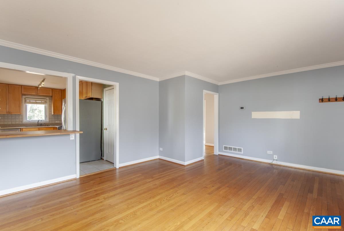 2600 Willard Drive Charlottesville, VA 22903 - Photo 7 of 47 a view of empty room with wooden floor and fan