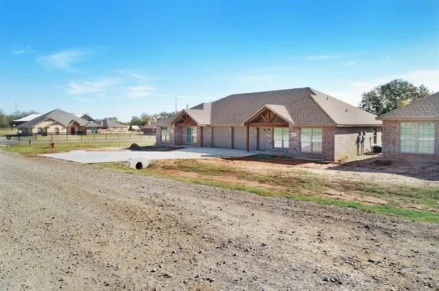 a view of swimming pool with a house in the background