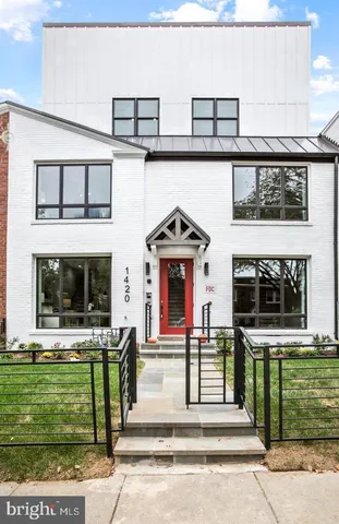 a front view of a house with a small yard
