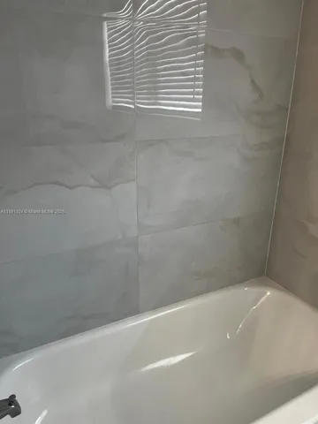 a bathroom with a bathtub