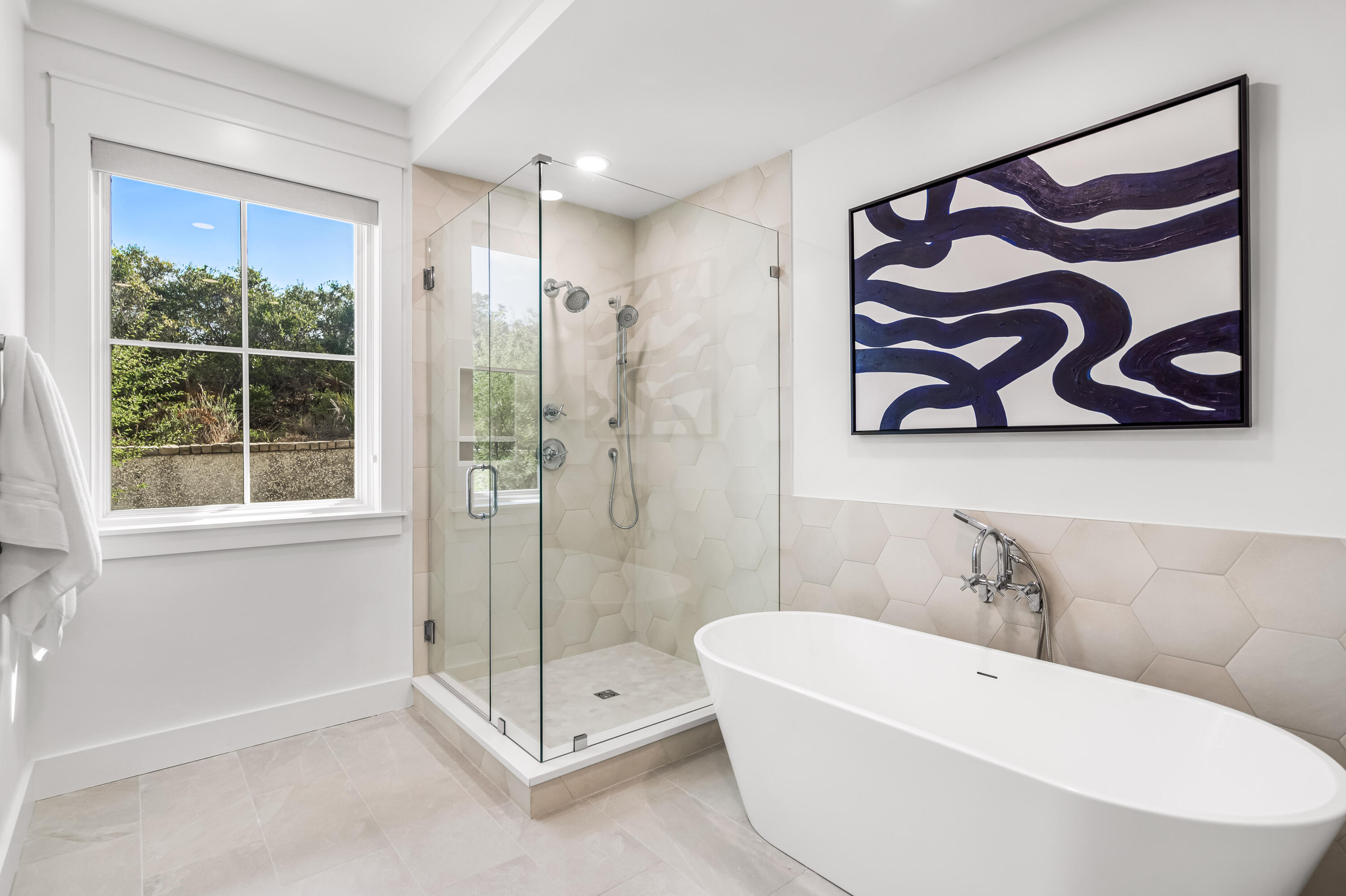 37 Compass Point Way South, Unit 109 Watersound, FL 32461 - Photo 21 of 46 a bathroom with a white tub shower and sink