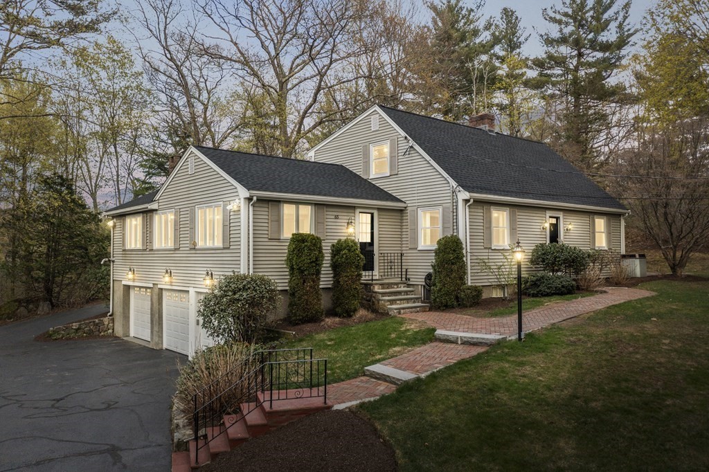 65 Charles River Street Needham, MA 02492 - Photo 2 of 21 a front view of a house with a yard and porch