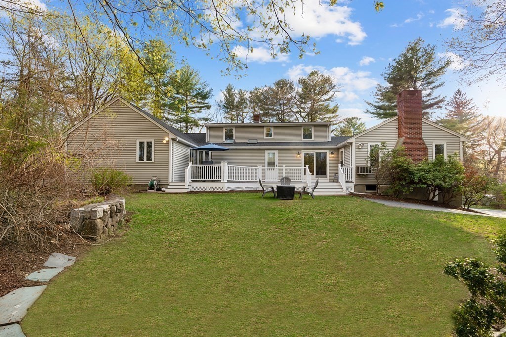 65 Charles River Street Needham, MA 02492 - Photo 3 of 21 a house view with a garden space