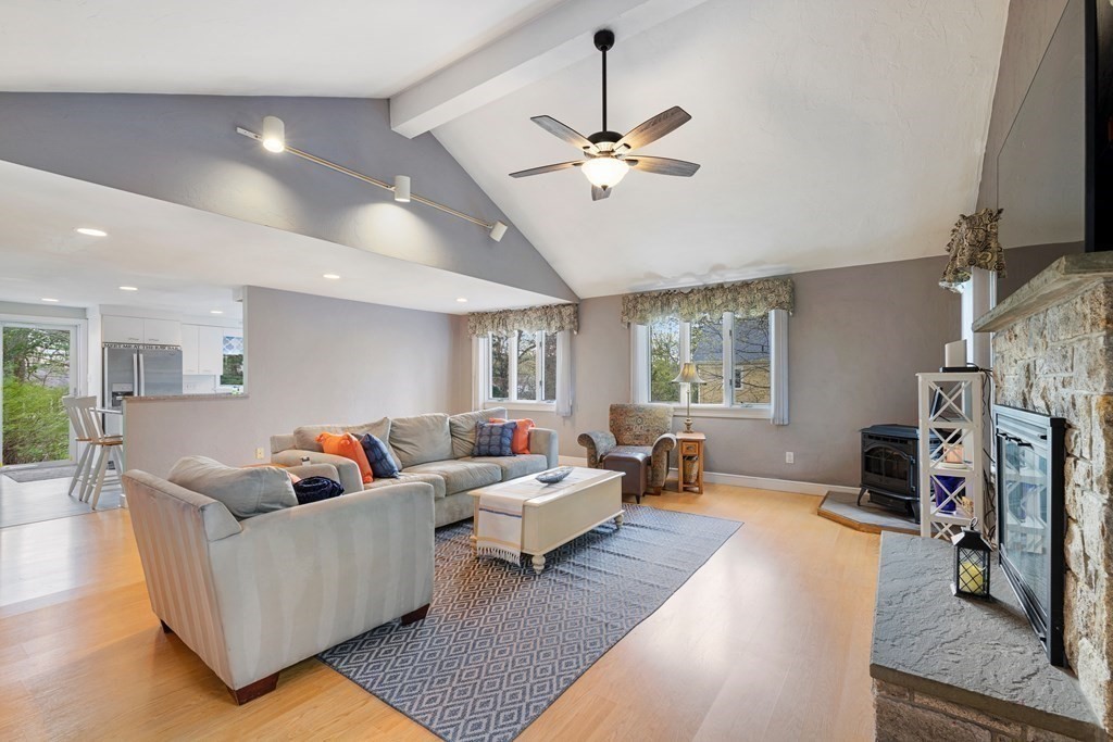 65 Charles River Street Needham, MA 02492 - Photo 4 of 21 a living room with fireplace furniture and a flat screen tv