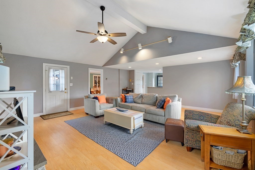 65 Charles River Street Needham, MA 02492 - Photo 5 of 21 a living room with furniture and a chandelier