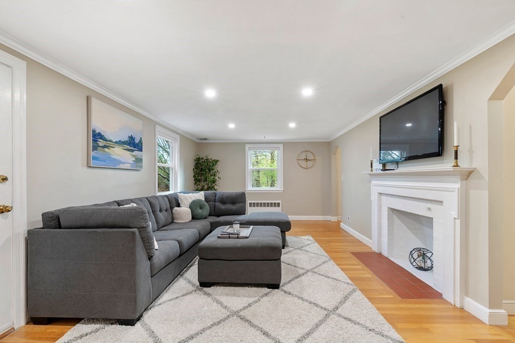 65 Charles River Street Needham, MA 02492 - Photo 8 of 21 a living room with furniture and a flat screen tv