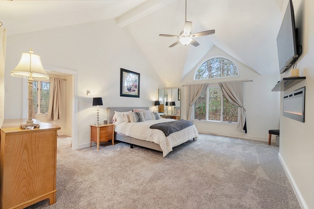 65 Charles River Street Needham, MA 02492 - Photo 9 of 21 a bed room with furniture and a chandelier