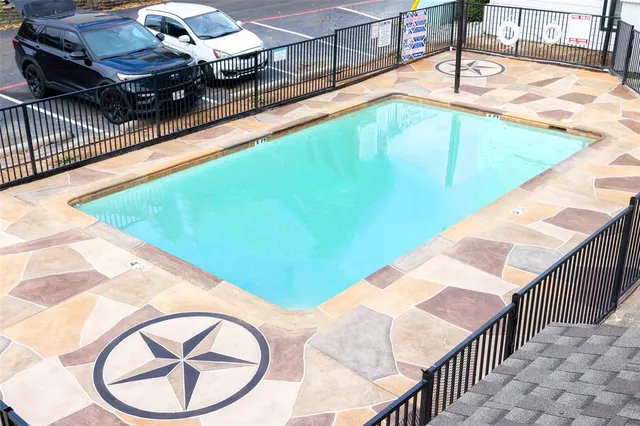 a view of swimming pool with a lounge chair