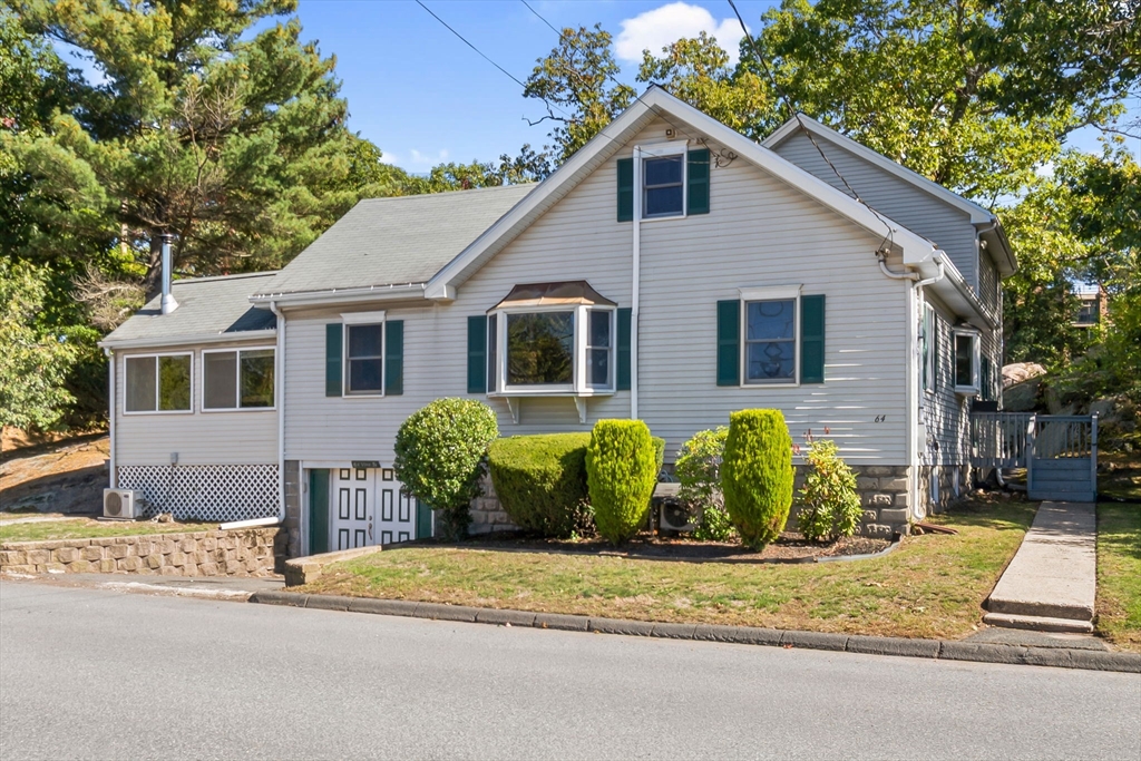 64 Vine Street Saugus, MA 01906 - Photo 1 of 42 a front view of a house with garden