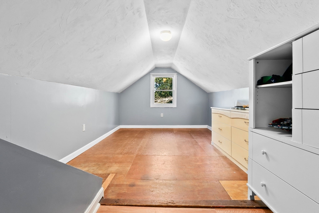 64 Vine Street Saugus, MA 01906 - Photo 23 of 42 a view of a kitchen cabinets and a wooden floor