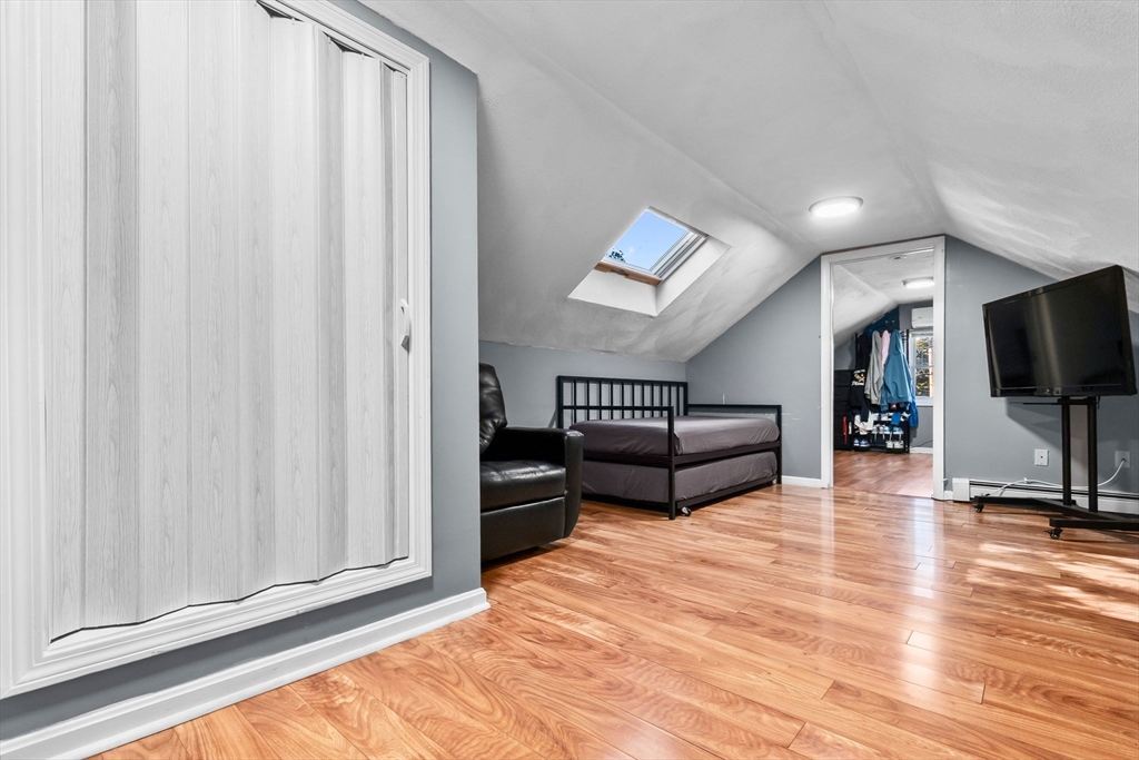 64 Vine Street Saugus, MA 01906 - Photo 26 of 42 a living room with furniture and a flat screen tv