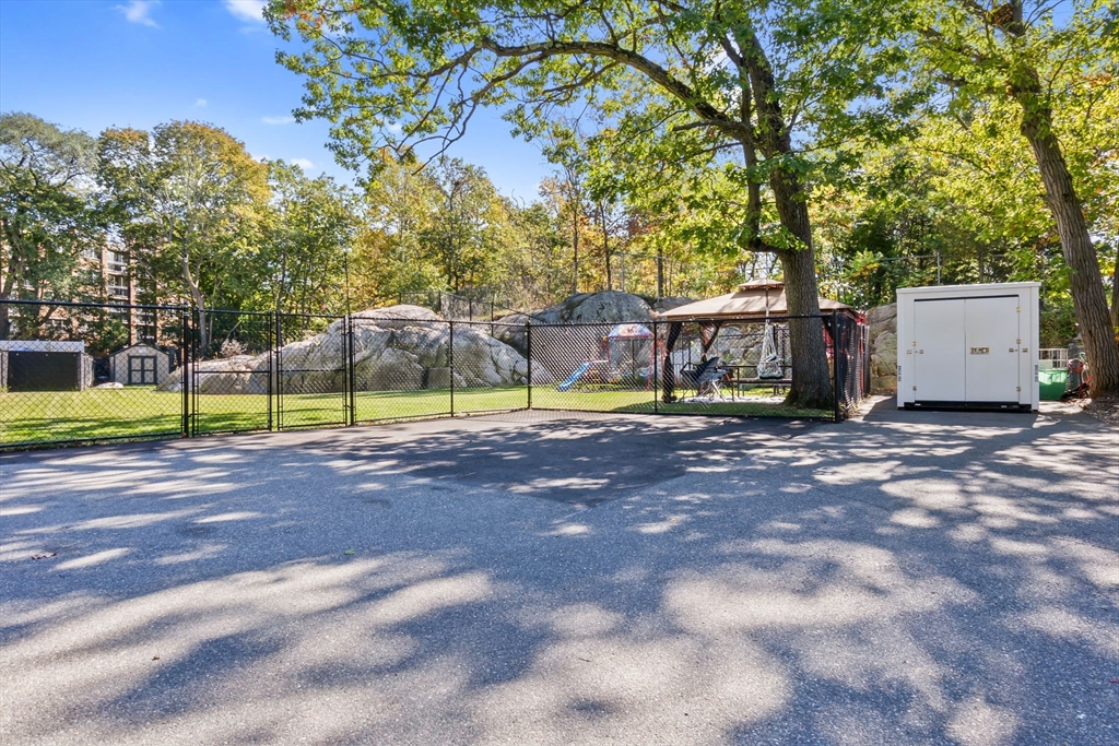 64 Vine Street Saugus, MA 01906 - Photo 32 of 42 a view of pool with lawn chairs and large trees