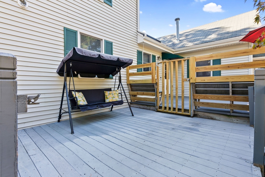 64 Vine Street Saugus, MA 01906 - Photo 33 of 42 a view of a house with a barbeque and wooden stairs