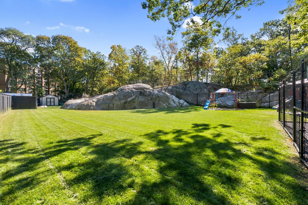 64 Vine Street Saugus, MA 01906 - Photo 36 of 42 a view of a swimming pool with a yard