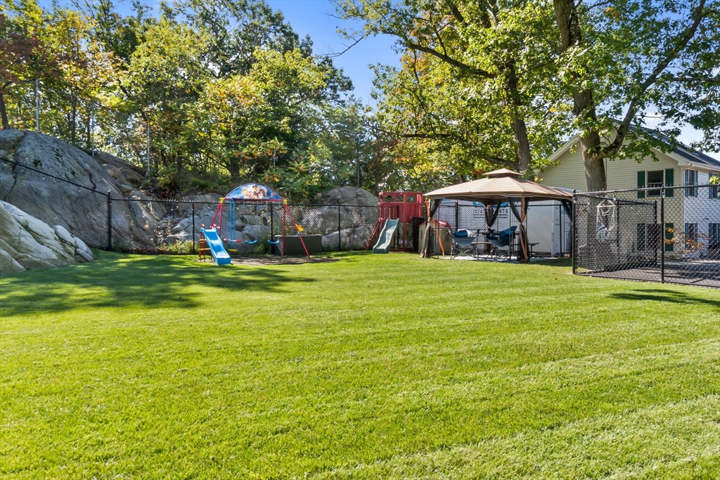 64 Vine Street Saugus, MA 01906 - Photo 37 of 42 a view of a house with a yard and sitting area