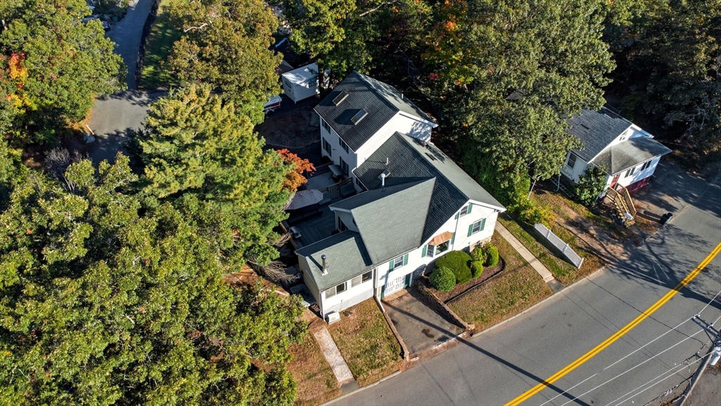 64 Vine Street Saugus, MA 01906 - Photo 41 of 42 an aerial view of a house with a yard and trees