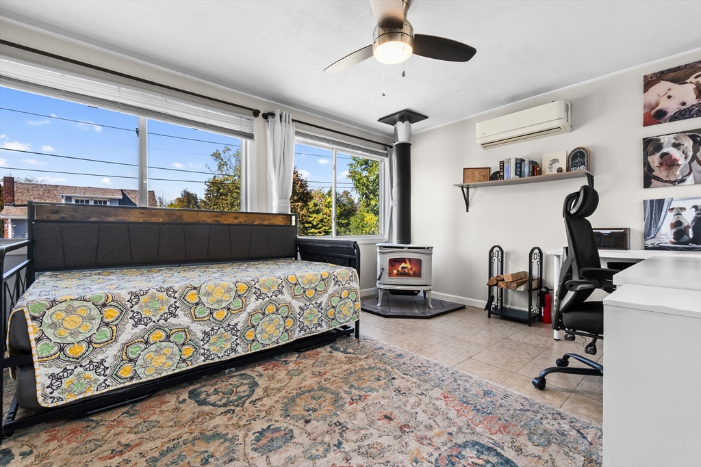 64 Vine Street Saugus, MA 01906 - Photo 10 of 42 a bedroom with bed and a large window