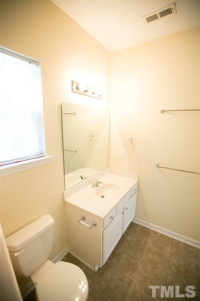 3214 Ranbir Drive Durham, NC 27713 - Photo 11 of 20 a bathroom with a sink a toilet and shower