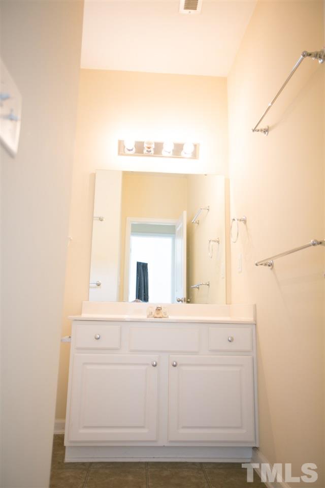 3214 Ranbir Drive Durham, NC 27713 - Photo 12 of 20 a bathroom with a sink mirror and a vanity