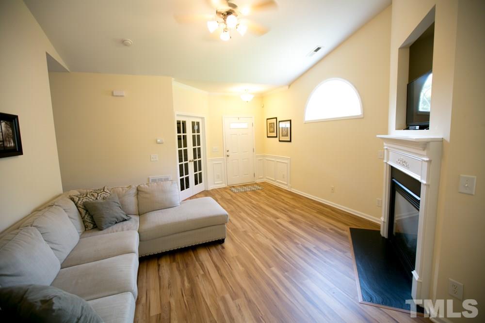 3214 Ranbir Drive Durham, NC 27713 - Photo 7 of 20 a bedroom with a bed and wooden floor