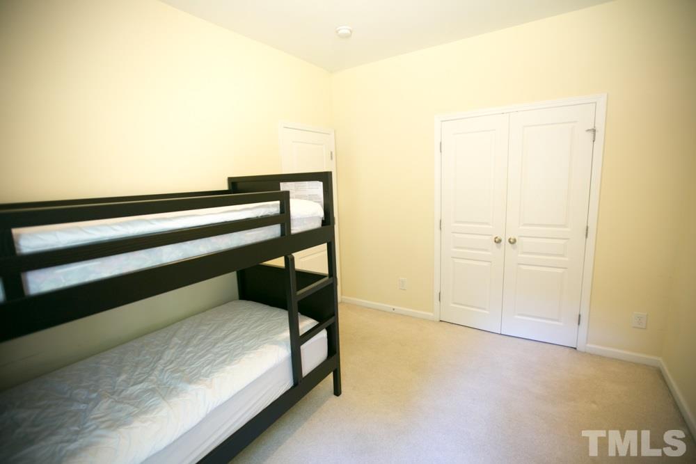 3214 Ranbir Drive Durham, NC 27713 - Photo 9 of 20 a view of a room with wooden floor and white walls